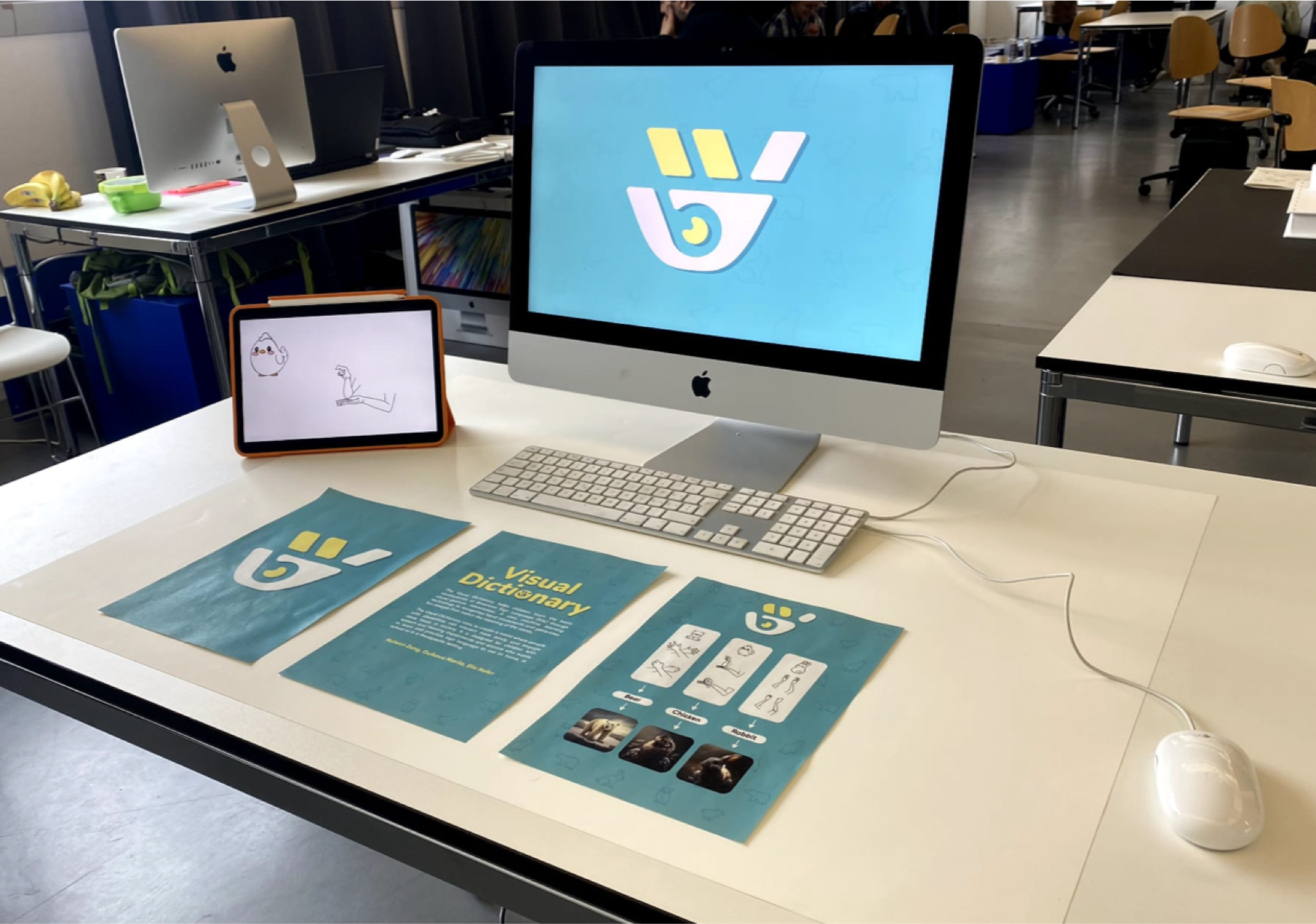 A user at the Geneva library exhibition practising the bear sign in front of the Visual Dictionary prototype